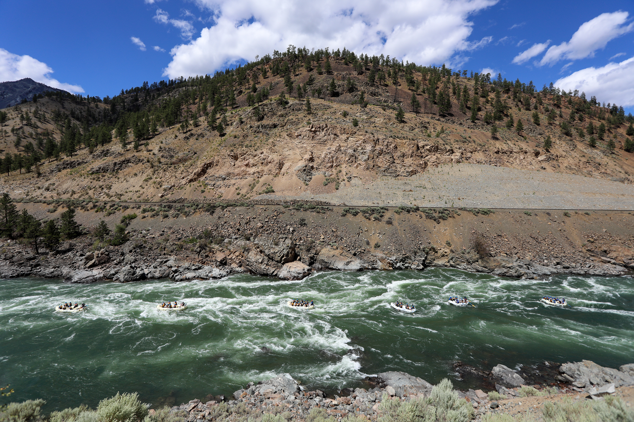 Paddle Rafts going down the Thompson River through the sunshine